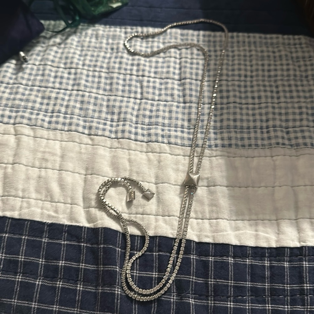 Beautiful sparkly sliding necklace. Middle square is adjustable. NEW no tags